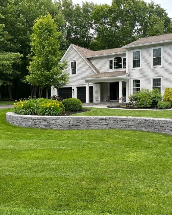 Fire pit, seat walls, and bluestone patio in Gorham, Maine