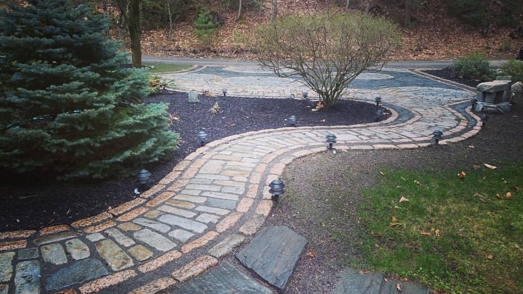 A different perspective on this lakeside cobblestone walkway and driveway in, Windham, Maine