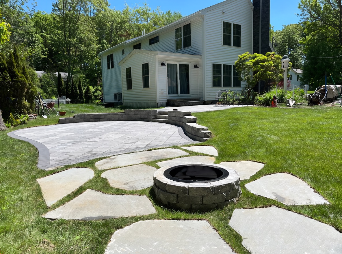 two tier patio retaining wall steps and fire pit area