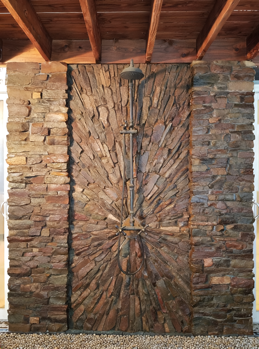 outdoor shower natural thin stone veneer sunburst