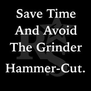 Nipping a corner off a concrete block with a hammer and chisel